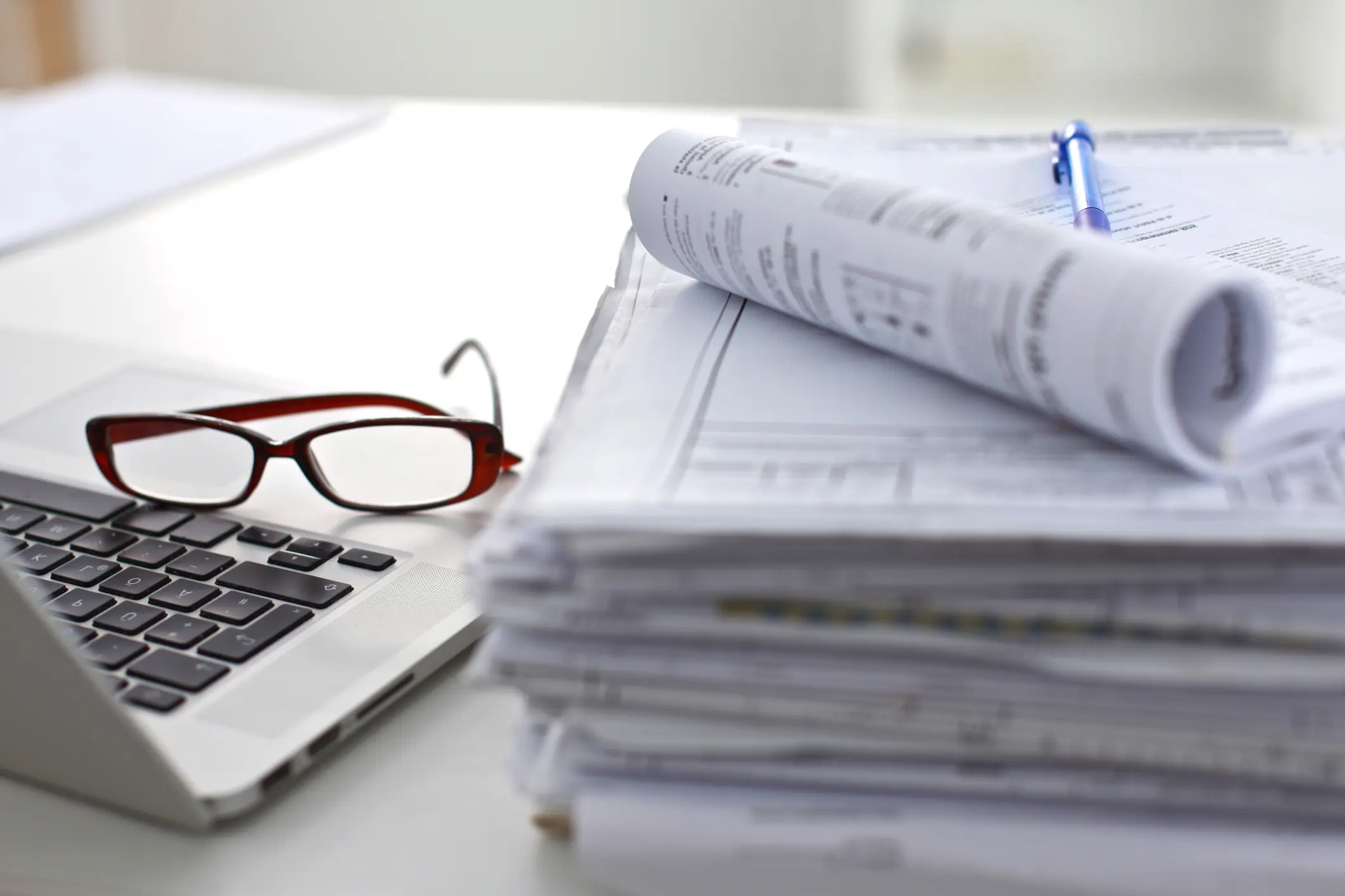 Glasses resting on laptop keyboard