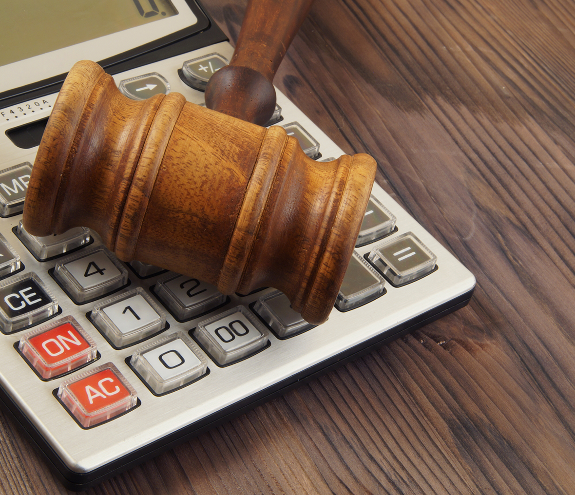 Wooden gavel and calculator