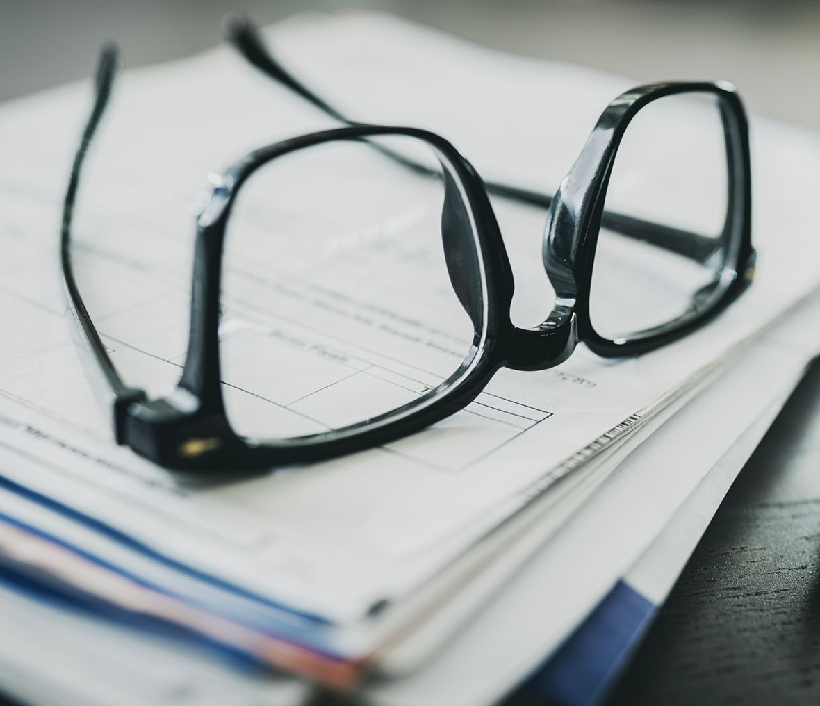 Eyeglasses on paperwork