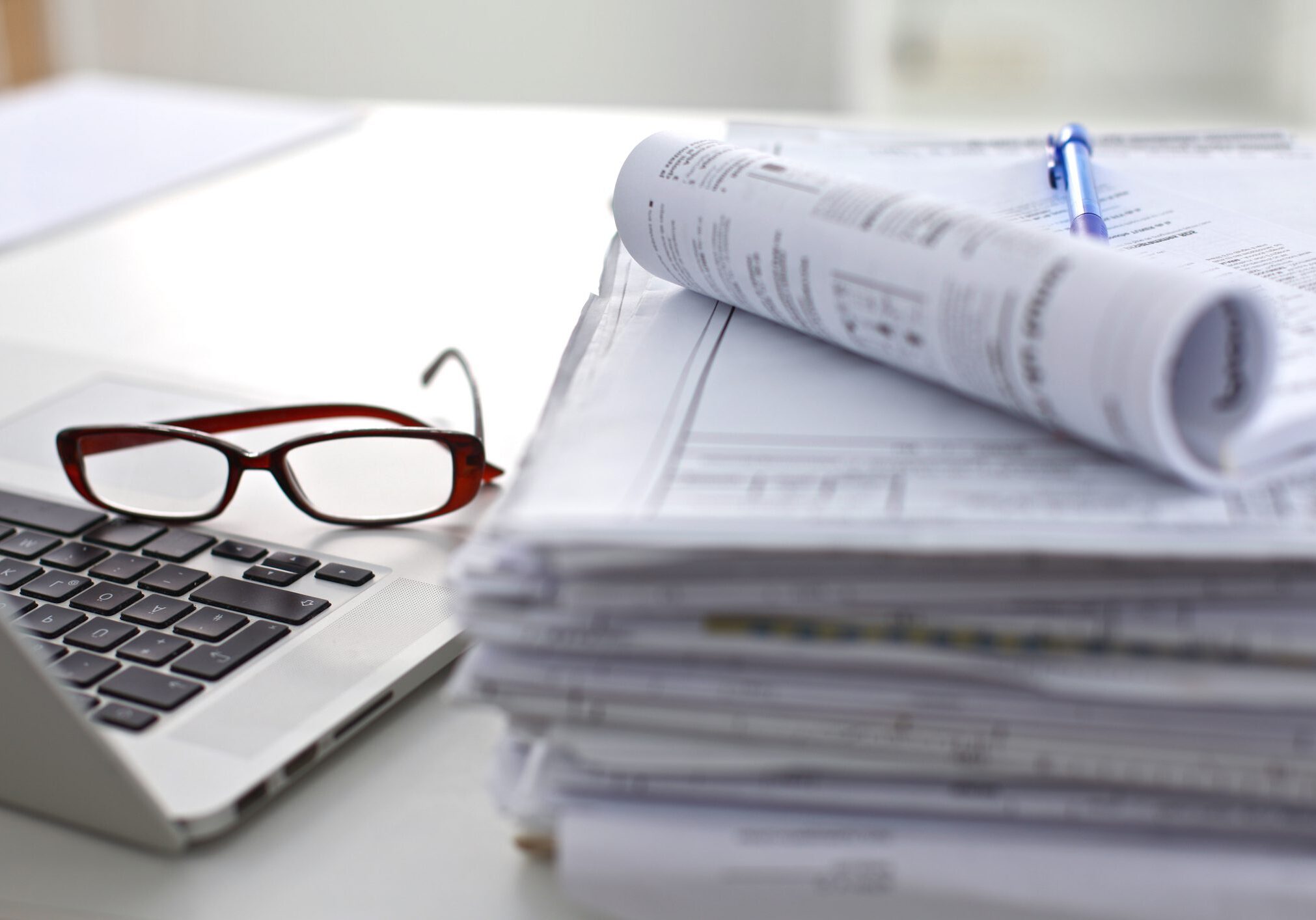 Glasses resting on laptop keyboard